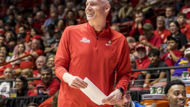 UNM head coach Eric Olen smiles as his team pulls away from Sam Houston during a game in the first round of the NIT on March 18 in the Pit.
