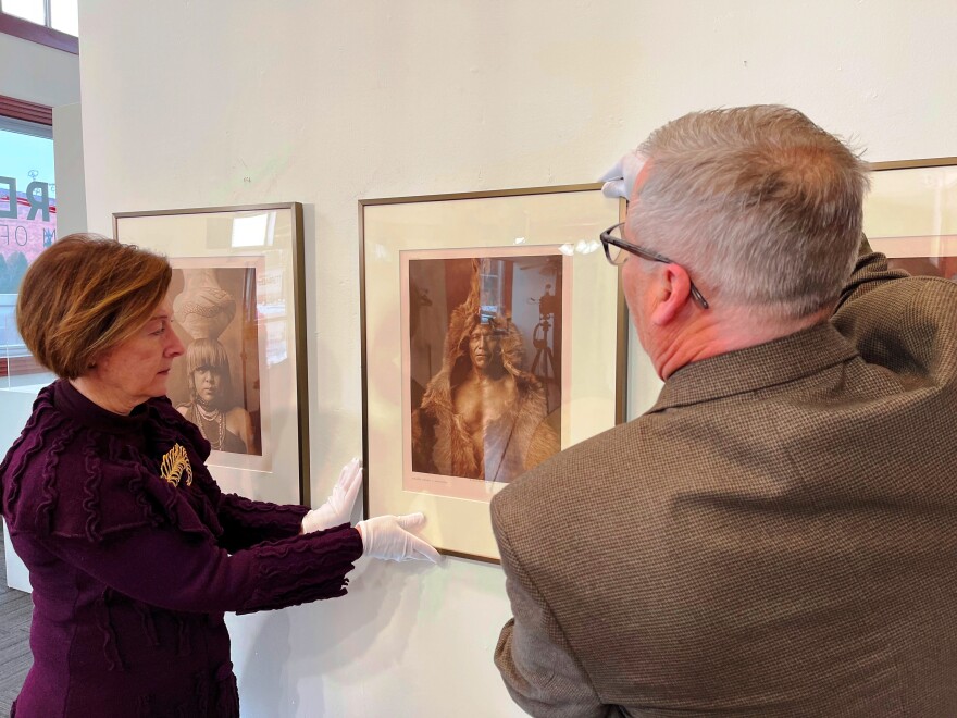 Gallery Coordinator Angela Green & Director Jim Gabbard gloved and hard at work hanging the 70 plus photographs by Edward Curtis for the Garrett Museum of Art's upcoming exhibit.