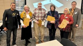 Some of WFYI's board members pose for a photo in our community room