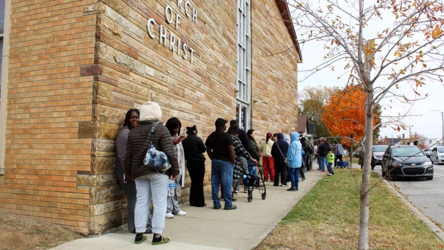 People line up around the Fountain Square Church of Christ off of Prospect Street on the southeast side of Indianapolis to receive free groceries on Saturday, Nov. 8, 2025. It is one of the first distribution events hosted with the city’s Office of Public Health and Safety. 