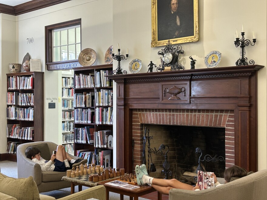 Kids read in the downstairs of the Blue Hill Public Library.