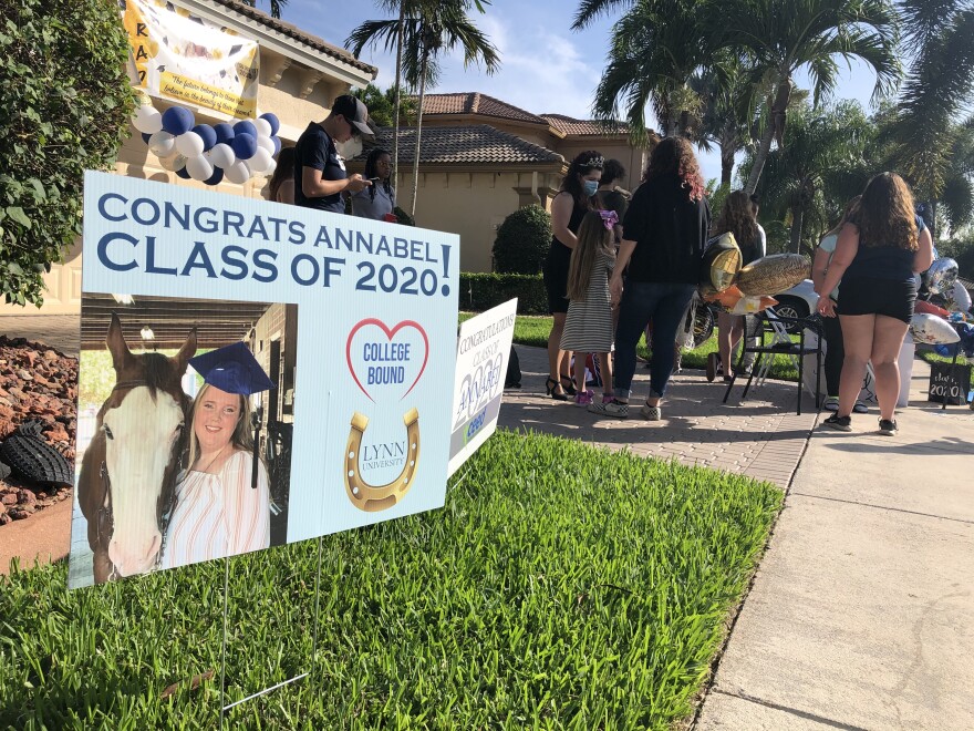 A sign congratulating Annabel Claprood on her graduation is in the lawn of her Coral Springs home.