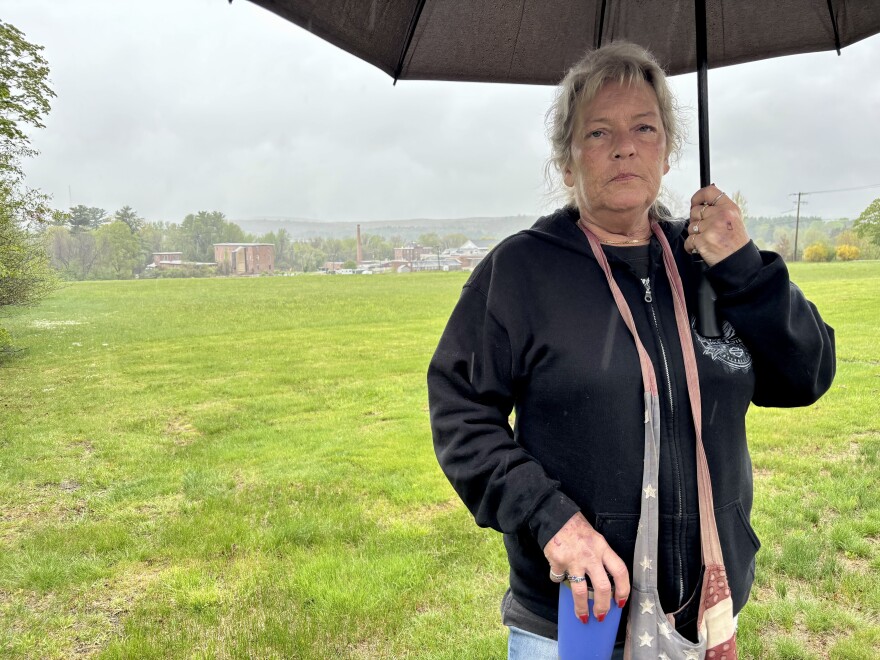 Shannon Wallace, of Raymond, stands outside the Sununu Youth Services Center in Manchester, where her teenage sons were held nearly 25 years ago. She didn't know they had been abused and neglected until years after they were released.