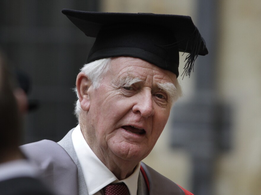 Author John le Carre poses for photographers following a ceremony at Oxford University on June 20.