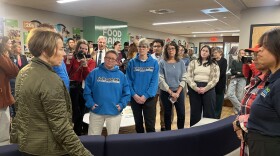 Massachusetts Governor Maura Healey [left] speaking with employees from the Food Bank of Western Massachusetts in Chicopee on Monday, following the state's disbursement of SNAP benefits to recipients.
