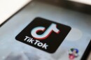 a smart phone with TikTok logo on the screen