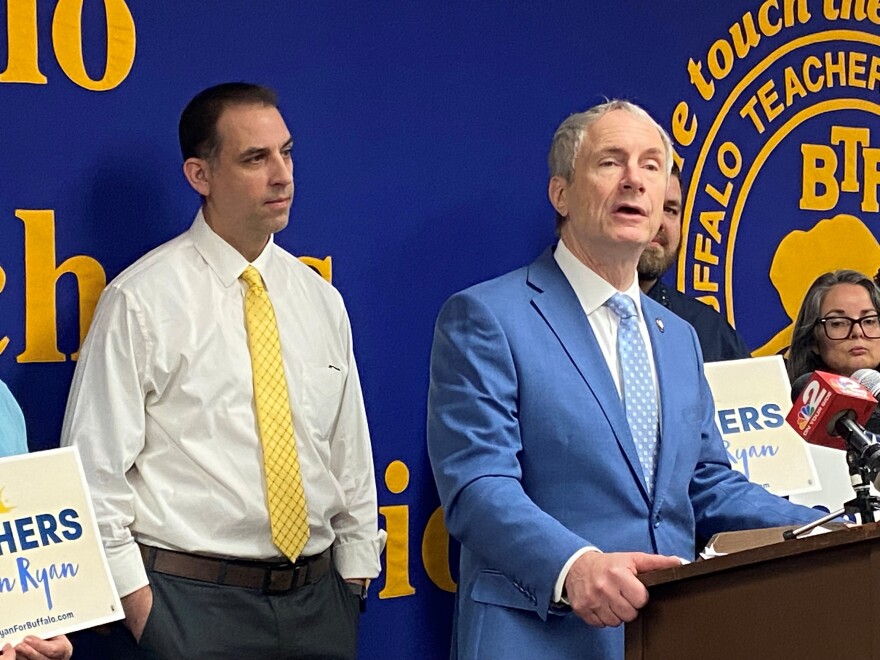 Buffalo Teachers Federation President Rich Nigro listens as State Sen. & Buffalo mayoral candidate Sean Ryan talks after learning he was endorsed by the teacher’s union.
