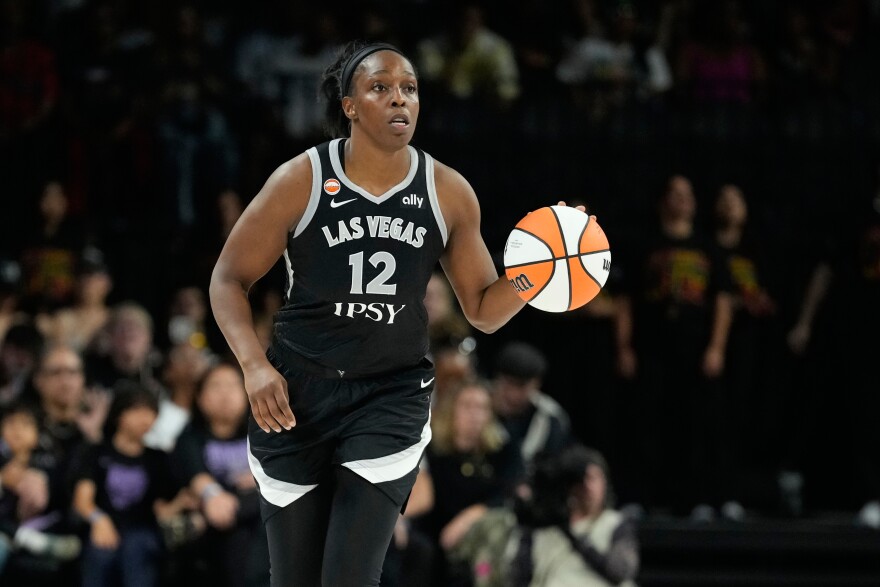 Las Vegas Aces guard Chelsea Gray (12) plays against the Golden State Valkyries in a WNBA basketball game Sunday, June 21, 2026, in Las Vegas. (AP Photo/John Locher)