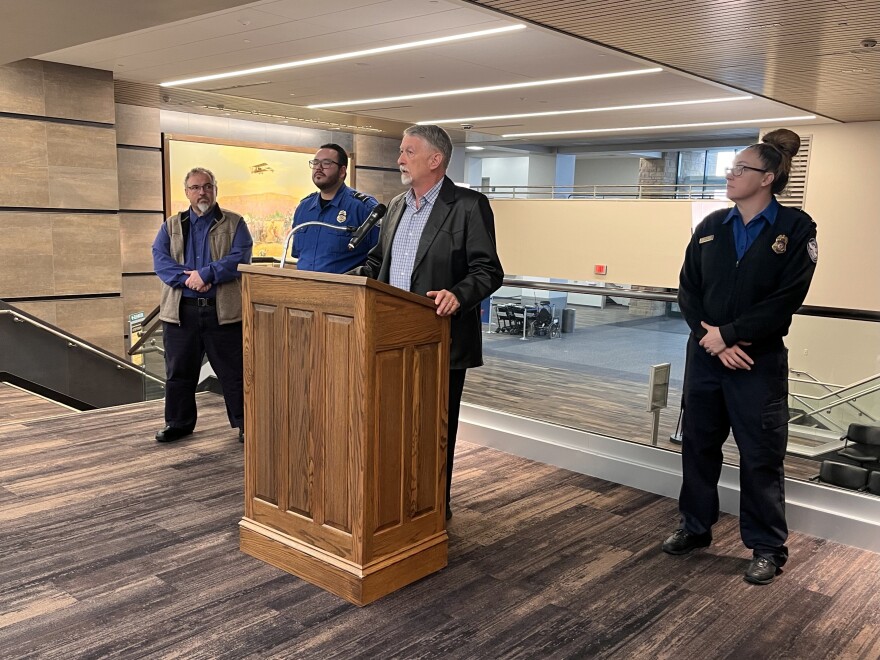 Billings Director of Aviation Jeff Roach speaks at Billings Logan International Airport Tuesday. TSA Federal Security Director for Montana KC Wurstbaugh stands on the far left.