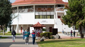 Students walk around on Merced College's main campus.
