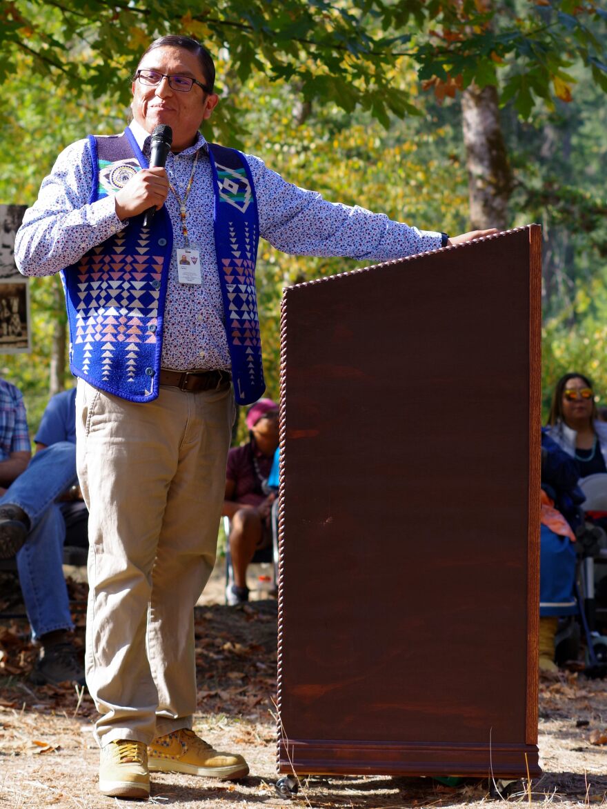 man in blue speaking
