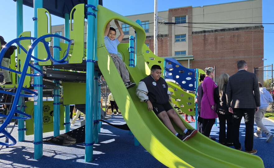 Students try the slides at the new playground at Whittier Elementary in Scranton.