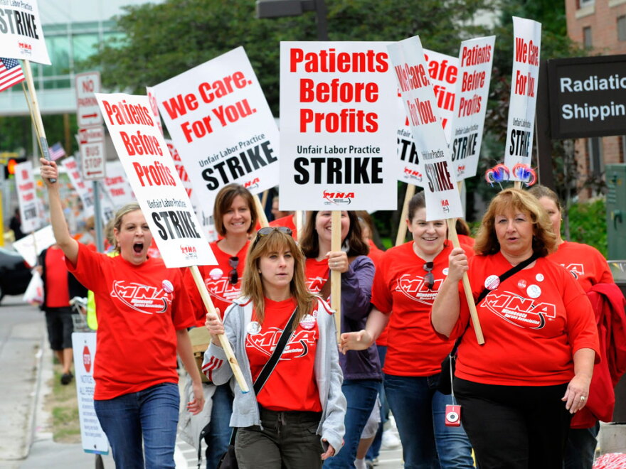 Nurses picket outside Abbott Northwestern Hospital in Minneapolis as part of a one-day strike at 14 Minnesota hospitals Thursday.
