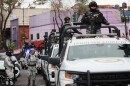 National Guards patrol the area outside of the General Prosecutor's headquarters in Mexico City, Sunday, Feb. 22, 2026, after authorities reported that the Mexican Army killed Jalisco New Generation Cartel leader Nemesio Oseguera, known as "El Mencho."