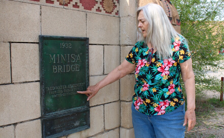 Susie Cunningham examines a plaque on Minisa Bridge in North Riverside. The name “Minisa” means “Red Water at Sunset”.