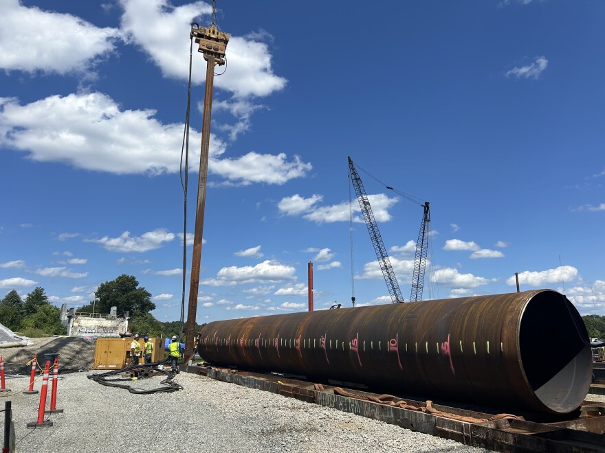 A steel beam is driven into the land on the Providence side of the Seekonk river, as part of the reconstruction of Rhode Island’s Washington Bridge on Wednesday August 19, 2026.