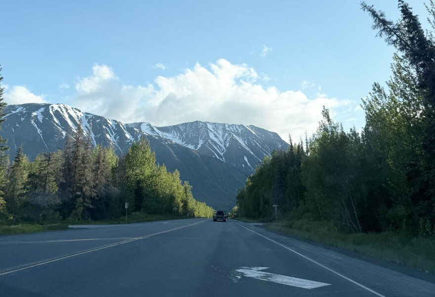 The sun sets over the Sterling Highway on Thursday, June 5, 2025 near Cooper Landing, Alaska.