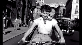 Audrey Hepburn and Gregory Peck in 'Roman Holiday,' a classic vacation movie.