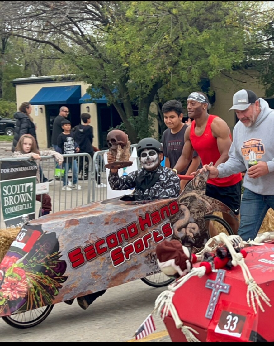 Victor Ambrosio and his crew with "La Bala." The group is hoping for a fourth win at the annual coffin races in Denton.
