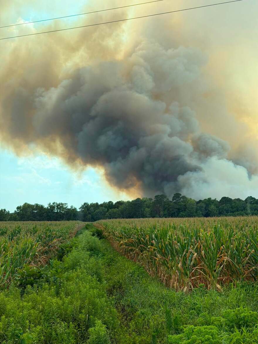 While the immediate threat to local homes has eased, authorities continue to monitor lingering hotspots and manage dense smoke spreading into neighboring coastal communities from separate blazes.