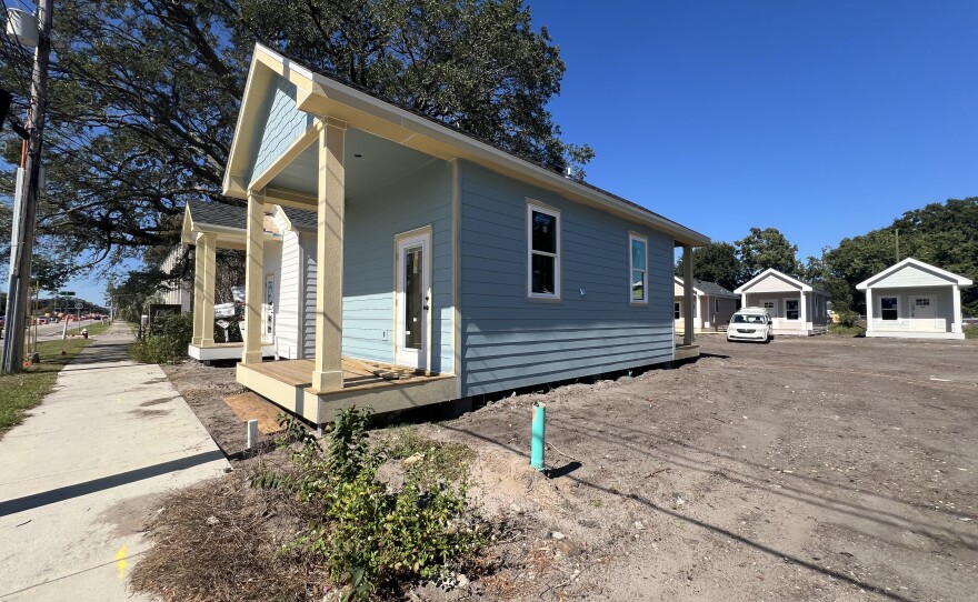 Along Garden Street in downtown Pensacola, Trinity Village’s row of tiny homes reflects a growing local push to create affordable, permanent housing.