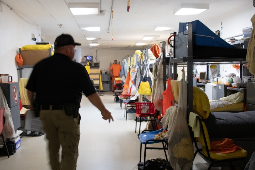 Sergeant Bryan Duke walks through the dorm-style rooms of the John H. Lilley Correctional Center.
