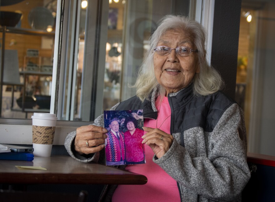 Garnett Akhivana holds a picture of her with her late husband, James Akhivana, a Vietnam veteran who died of chronic obstructive pulmonary disease. She said she believes Agent Orange played a role in his medical condition.