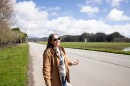 Irma Rodriguez Mitton stands on Pescadero Creek Road, a pivotal road that connects the town to Highway 1 and often gets flooded.