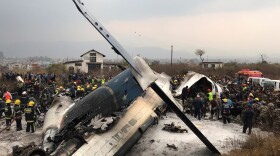 Rescue workers rushed to the scene of a US-Bangla Airlines jetliner that crashed at an airport in Kathmandu, Nepal, on Monday.