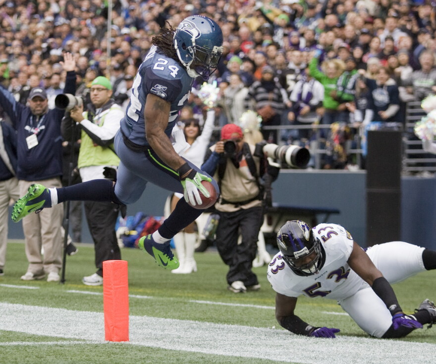 Seattle running back Marshawn Lynch makes a run against the Baltimore Ravens at CenturyLink Field in 2011.