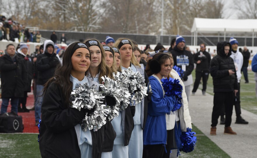 Cheerleaders for St. Francis await the start of the Class 5A game Tuesday in Normal. St. Francis beat fellow Chicago Catholic League school Providence Catholic, 39-35.