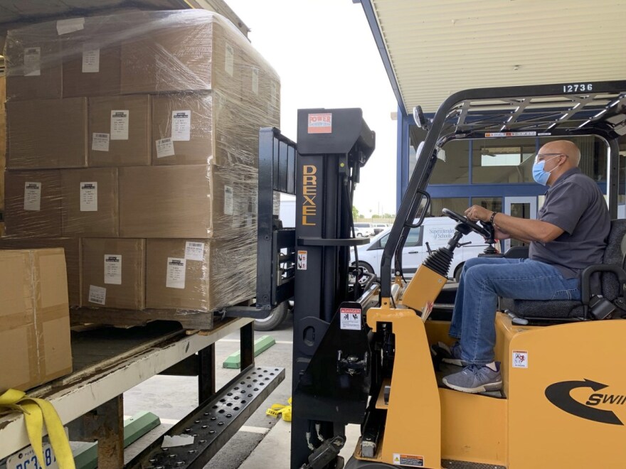 A delivery of state-supplied masks, face shields, no-touch thermometers, and hand sanitizer arrive for when Kern County schools are able to open for in-person instruction. Photo courtesy of Kern County Office of Education