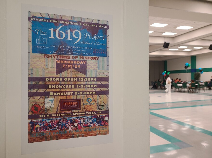 A flyer in the Greenwood Cultural Center about a showcase from summer camp attendees based on the 1619 Project.