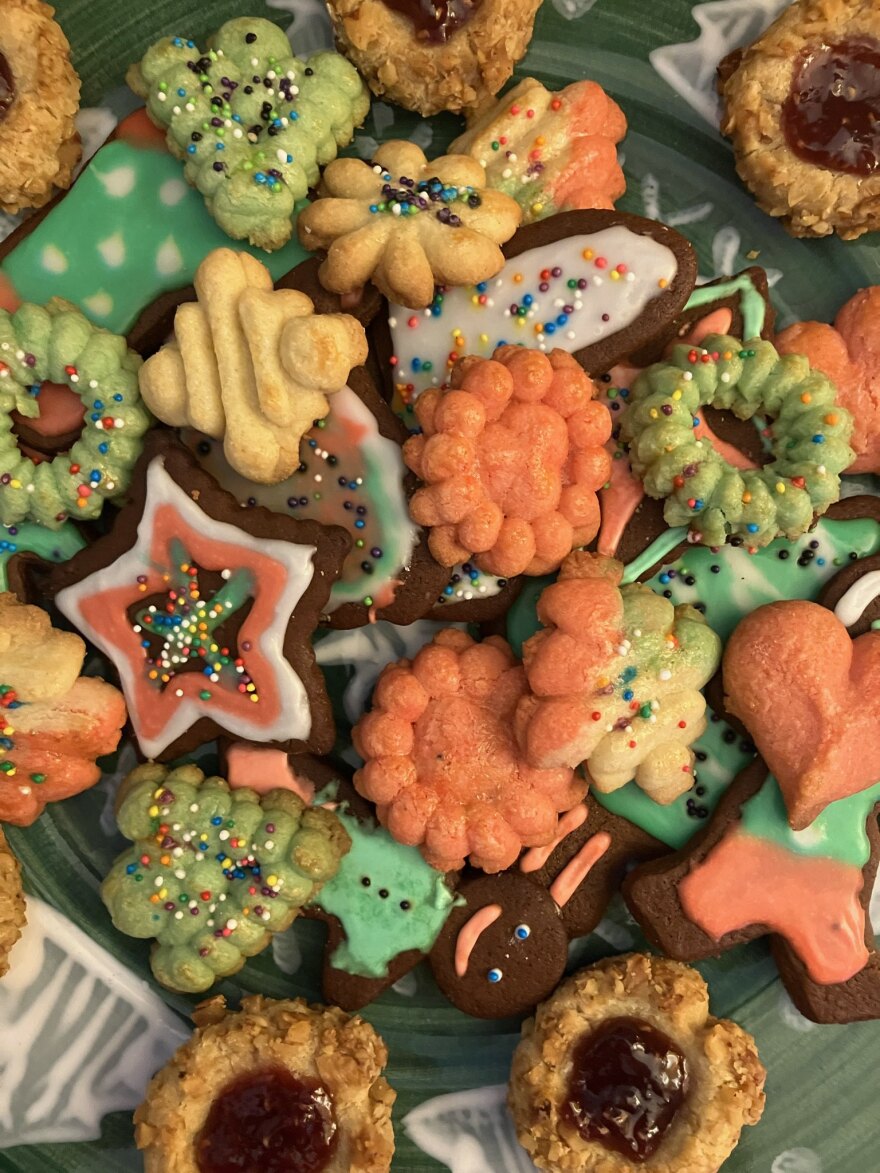 A selection of colorful cookies, including spritz and thumbprint cookies.