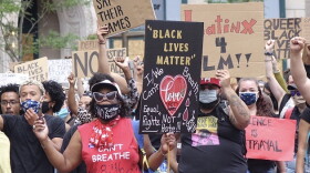 A rally organized by the Indiana Racial Justice Alliance drew several hundred people to Monument Circle on Saturday, June 13, 2020. The group wants the city to reduce the budget of IMPD and reinvest the funds in new community-led initiatives.