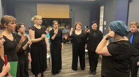 Members of the Children's Chorus of San Antonio warm up before performing live on KPAC 88.3 FM.