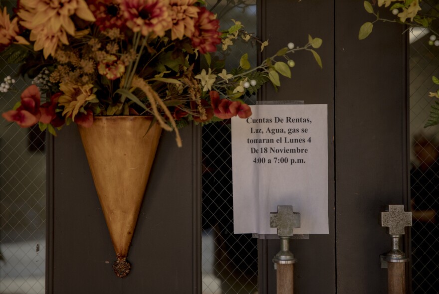 A sign on the door at Morton United Methodist Church announces the hours for the next bill assistance session for local families affected by ICE raids.