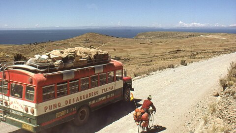 Greg Siple, on the road in Peru in 1974, with Lake Titicaca in the background.