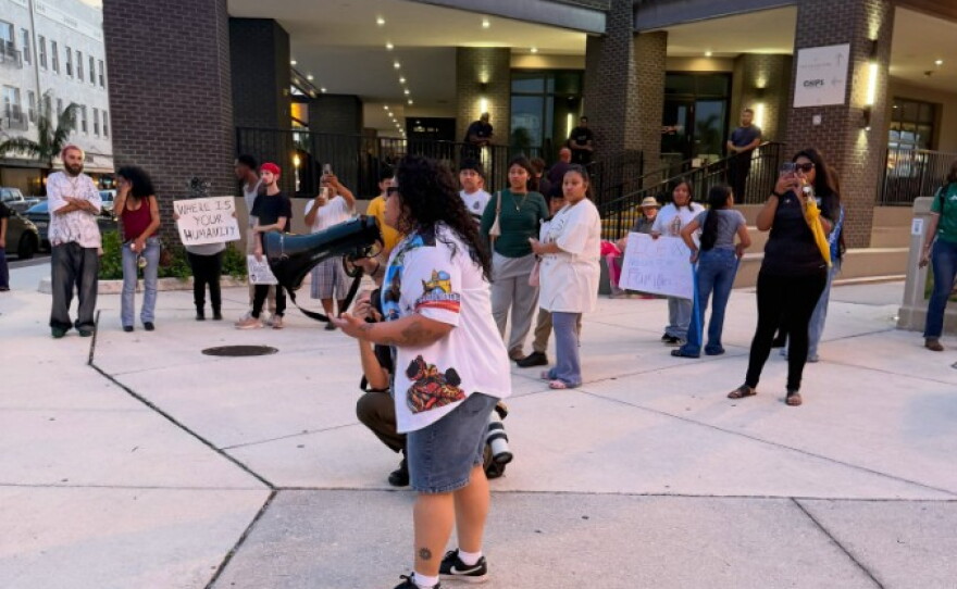 About 150 people protested the presence of Immigration and Customs Enforcement agents at area hotels at a rally Wednesday near the Luminary Hotel in downtown Fort Myers.