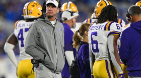 LSU head coach Lane Kiffin, left, looks on during the first half of an NCCA college football game against Kentucky, Saturday, Oct. 10, 2026, in Lexington, Ky. (AP Photo/Tanner Pearson)
