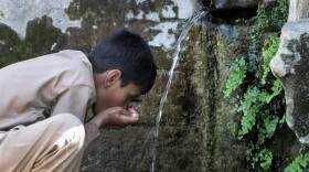 A boy drinks water from a line connected with a waterfall on the outskirts of Mingora, the main town of Pakistan's Swat valley The flooding in Pakistan killed at least 1,700 people, destroyed millions of homes, wiped out swathes of farmland, and caused billions of dollars in economic losses. In Khyber Pakhtunkhwa, residents had to rely on contaminated water, so now authorities are taking steps to prepare for the next disaster. (Naveed Ali/AP)