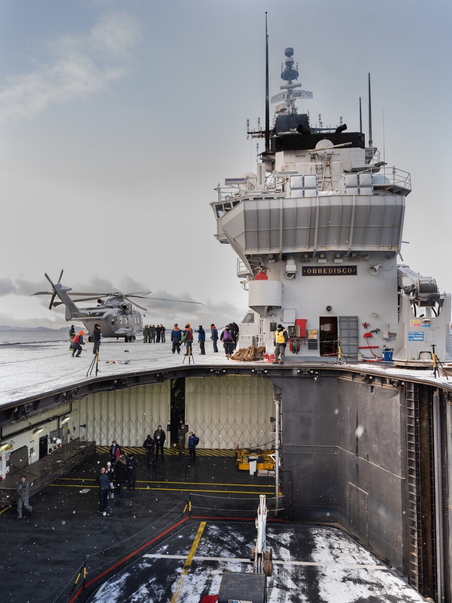 Italian aircraft carrier <em>Giuseppe Garibaldi,</em> with its flight deck elevator lowered, sailing in a Norwegian fjord above the Artic Circle. <em>Obbedisco</em> - "<em>I obey"</em> was the motto of Italian military hero Giuseppe Garibaldi.