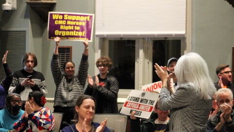 Legislators and attendees celebrated after the resolution passed.