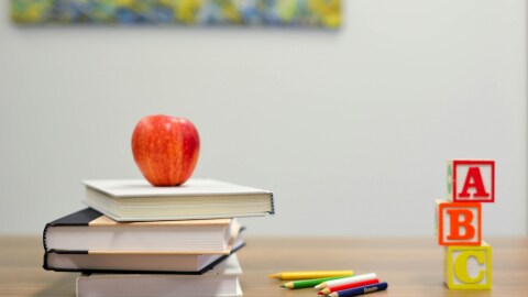 Teacher desk with books