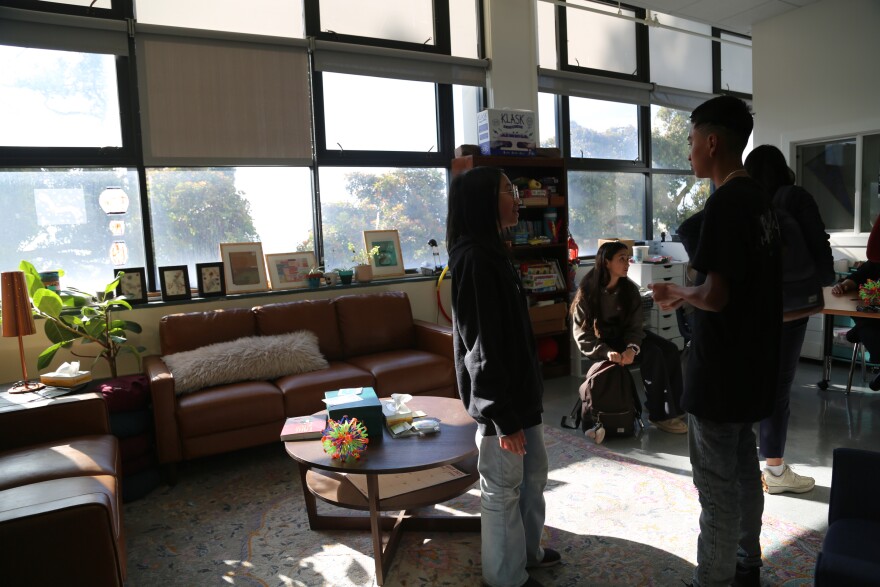 Olivia Huang, Josue Garcia Moreno, and Maile Bellet in the wellness center.