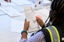 Wake County Board of Elections employees prepare absentee ballots to be mailed on Thursday, Sept. 3, 2026, in Raleigh, N.C.
