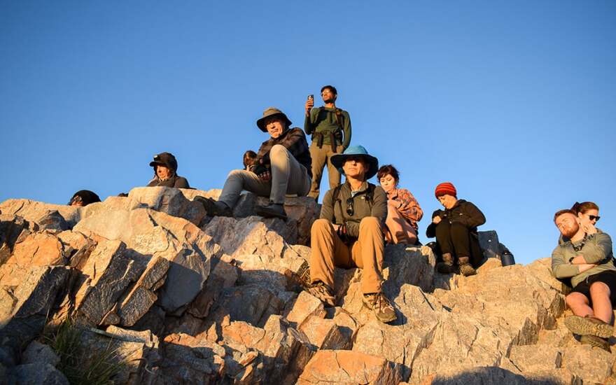 People gather at the top of the mountain