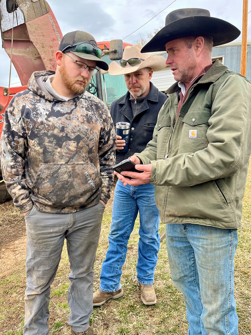 Rancher Lamont Herman discusses his tractor problems on the ranch in St. Xavier