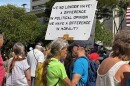 A sign at the "No Dictators" rally reads, "We no longer have a difference in political opinion. We have a difference in morality," in Honolulu on March 28, 2026.