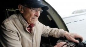 Richard Calland of Maysville observes from a machine gun port Friday while flying on the Aluminum Overcast B-17 Flying Fortress. Calland is a United States Navy veteran and enjoys vintage military aircraft.